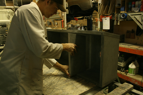 Greg Seuren putting the center divider in a Soapstone Sink